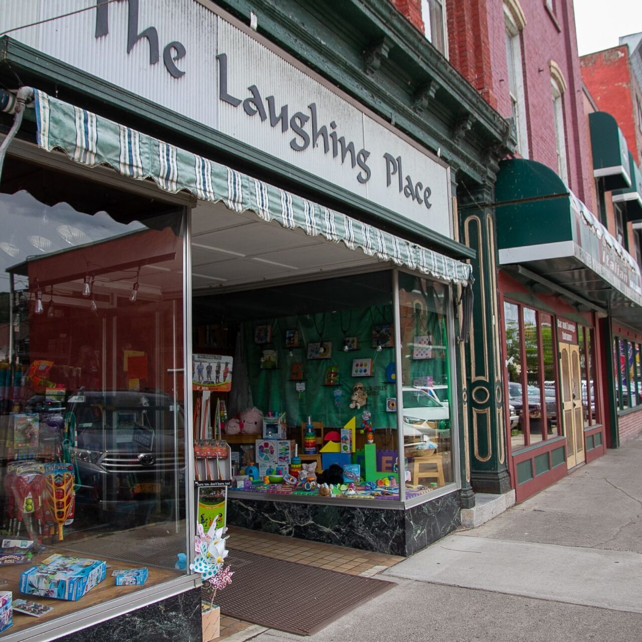 exterior of toy store called "the laughing place"